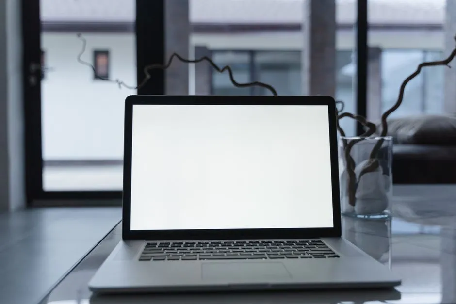 Close-up of a laptop screen showing a grid of abstract shapes in a pattern recognition question