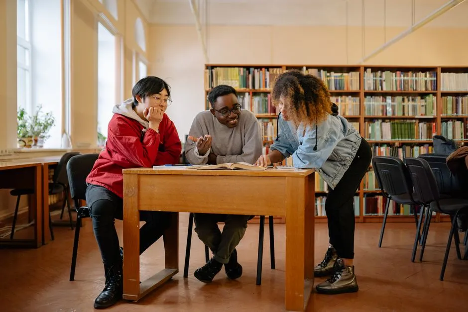 Student at a library table timing herself on a logical reasoning question with a phone stopwatch